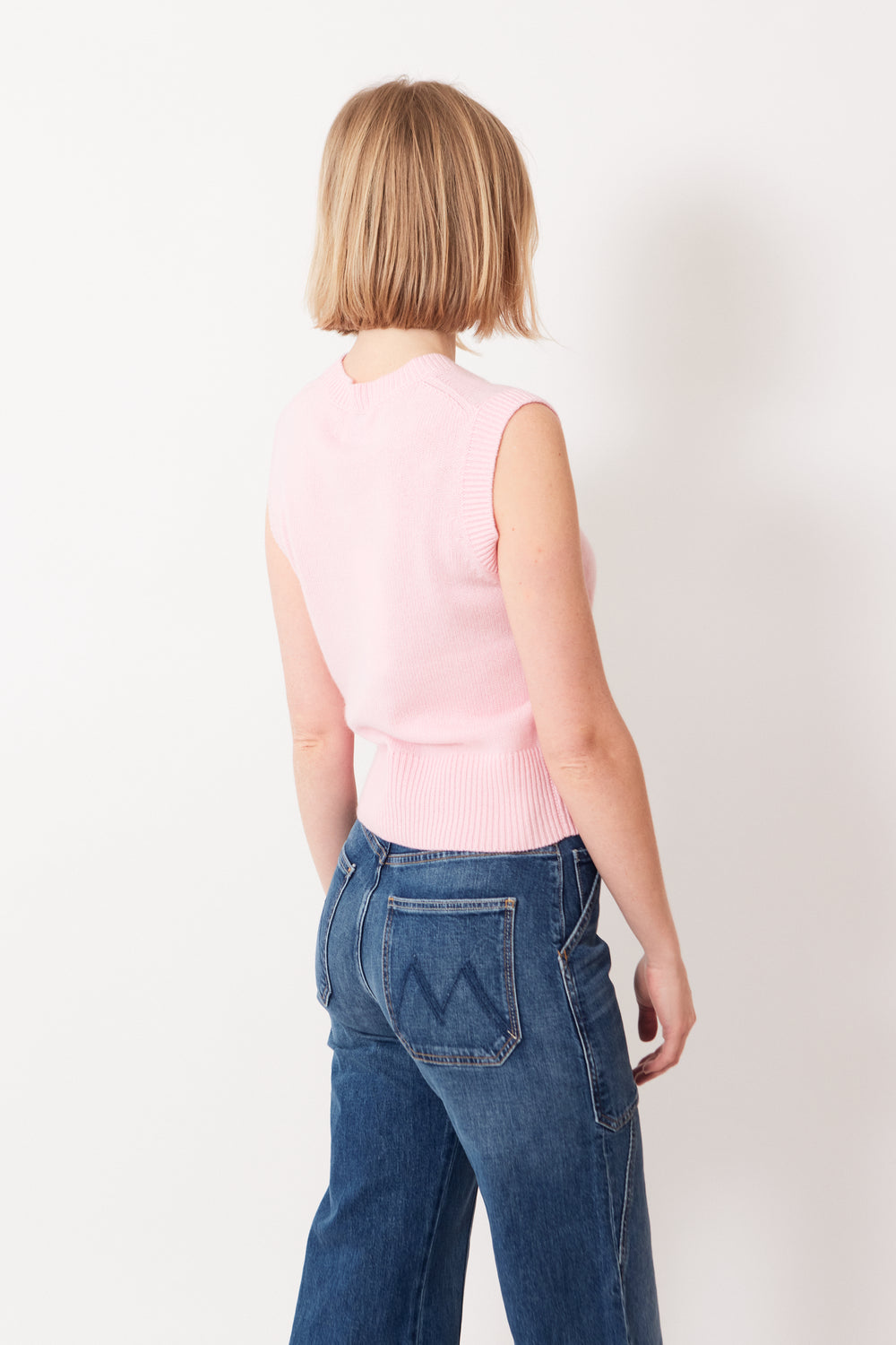 Madi wearing Allude Cashmere True Joy Sweater Vest rear view