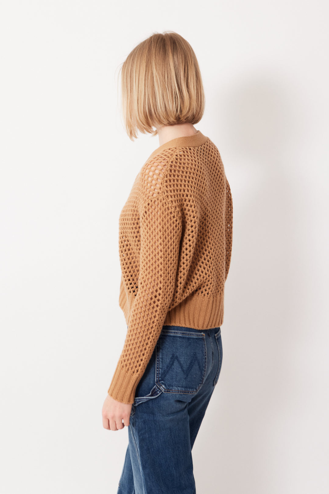 Madi wearing Allude Open Weave V Cardigan rear view