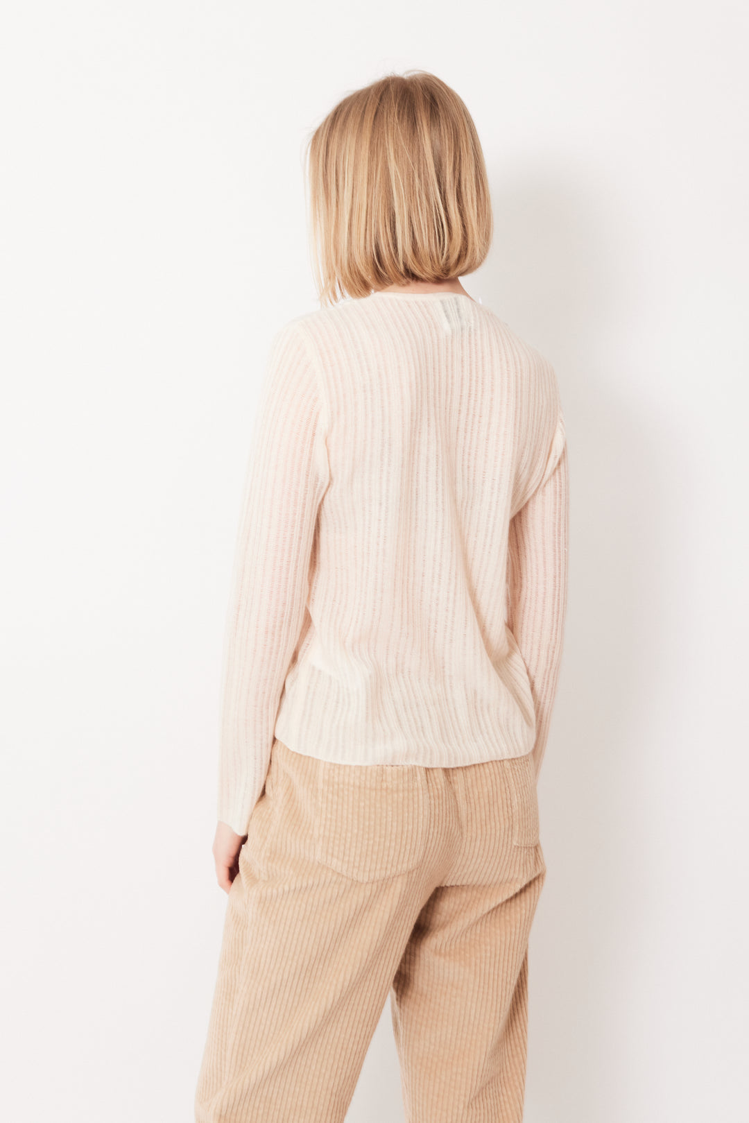 Madi wearing Allude Delicate Sheer Cashmere True Joy Sweater rear view