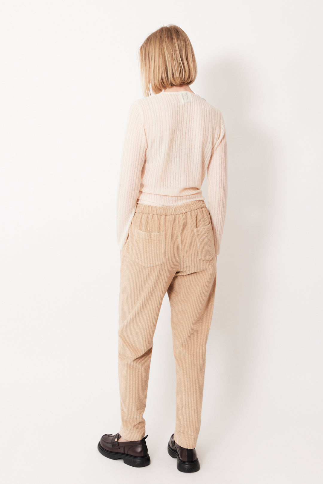 Madi wearing Rosso 35 Wide Wale Corduroy Elasticated Back Pant rear view