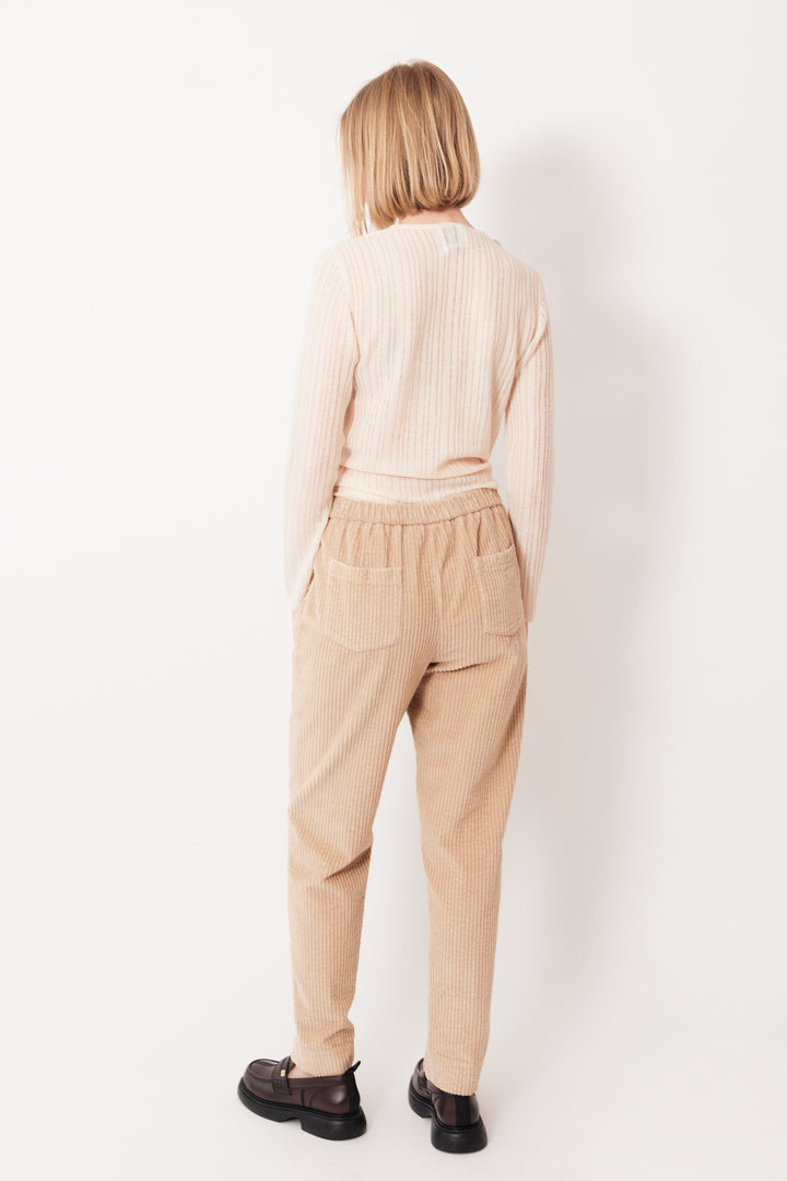 Madi wearing Rosso 35 Wide Wale Corduroy Elasticated Back Pant rear view