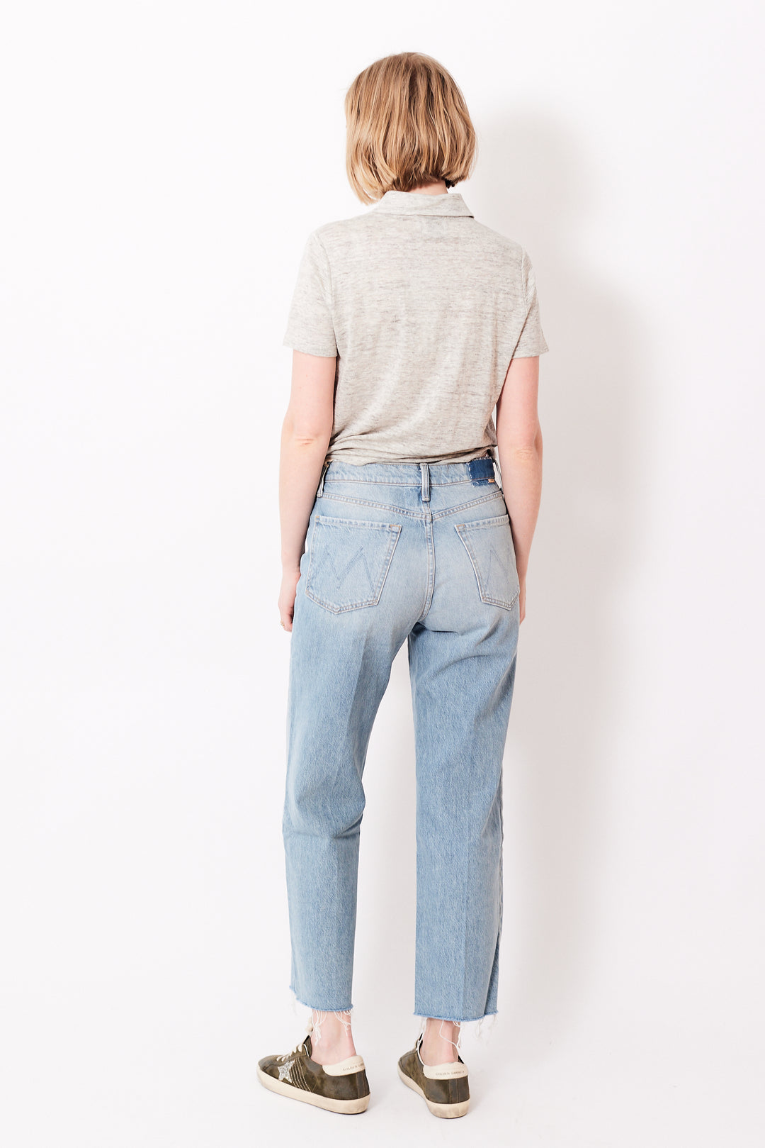 Madi wearing Mother Denim The Rambler Zip Ankle Fray rear view