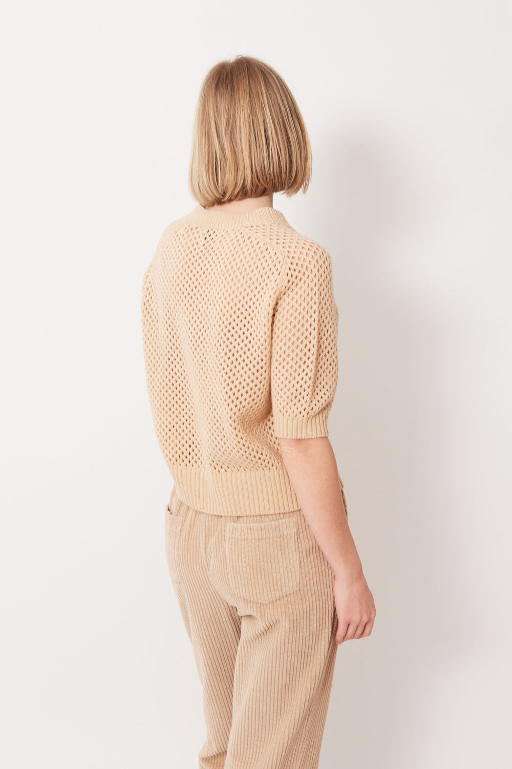 Madi waring Allude Half Sleeve Open Weave Sweater rear view