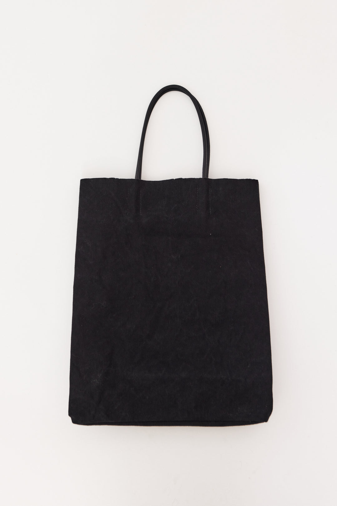 Flat lay of Amiacalva Paper Bag T