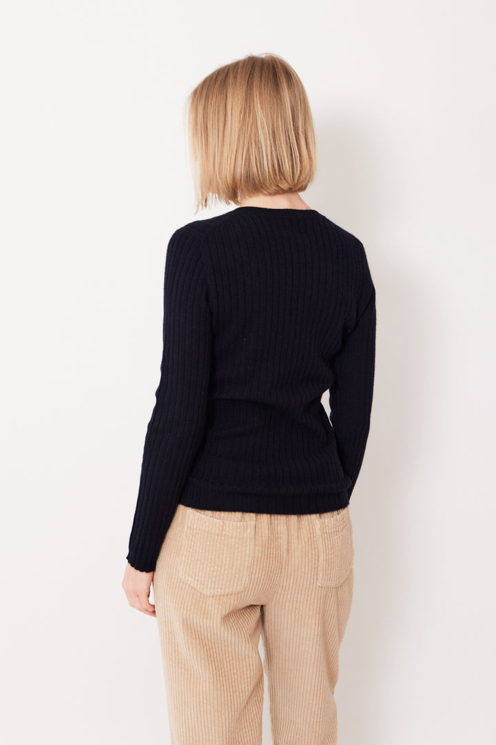 Madi wearing Allude Ribbed Cashmere True Joy Sweater rear view