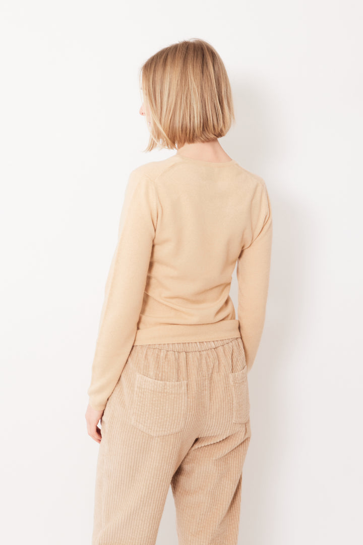 Madi wearing Allude Finer Cashmere Deeper V Sweater rear view