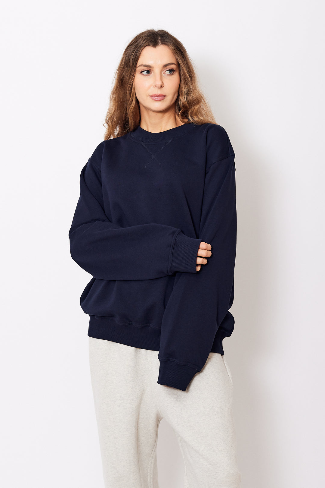 Mari wearing Sofie D'Hoore Tilt Top Stitch Sweatshirt front view