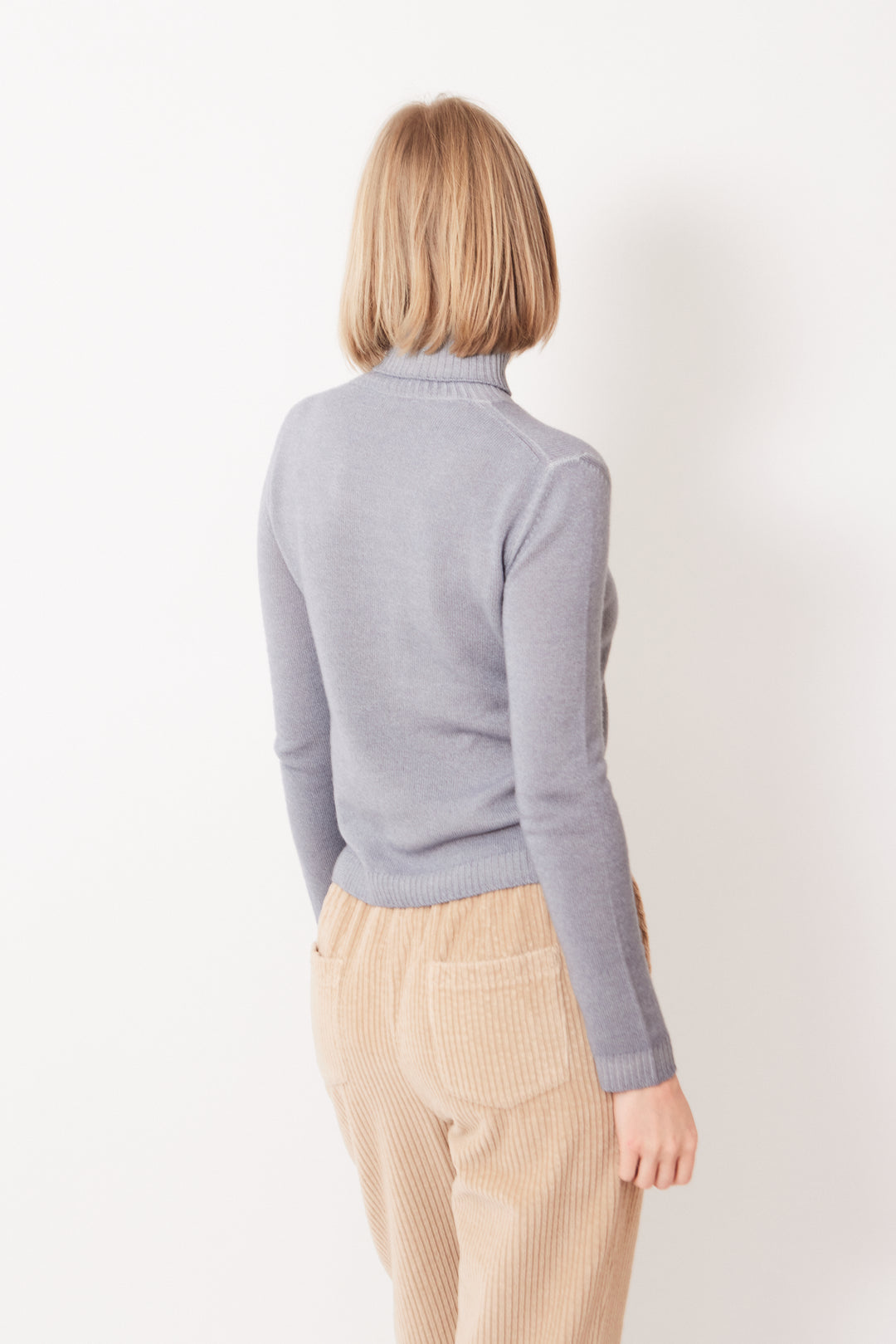 Madi wearing Base Snow Dye Turtleneck Sweater rear view