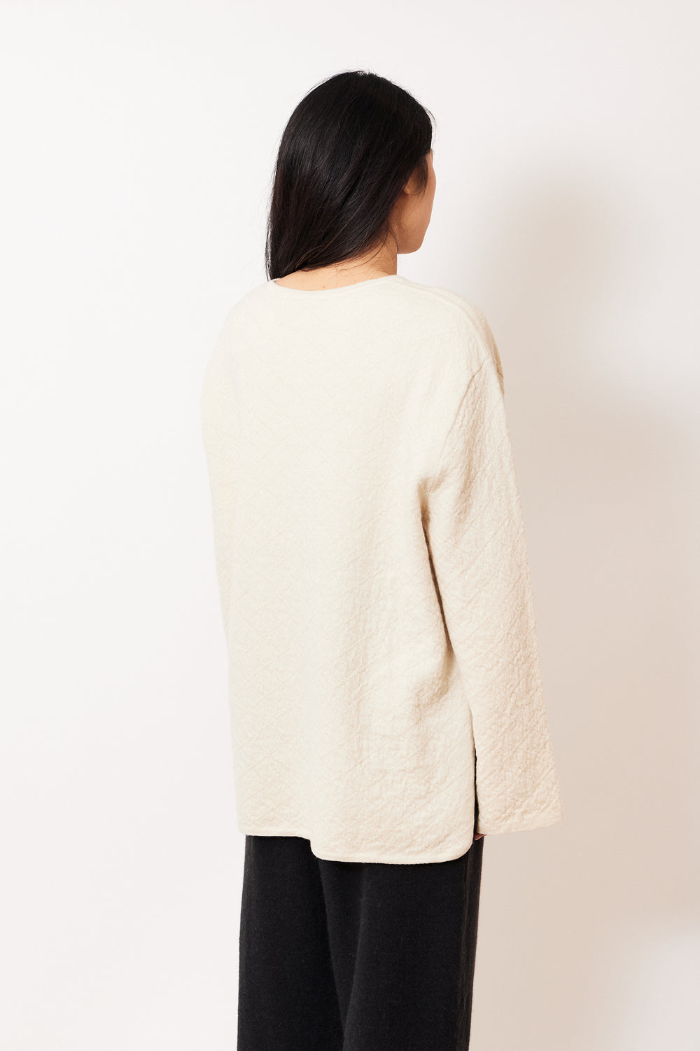 Madelyn wearing Lauren Manoogian Diamond Quilt Pullover rear view