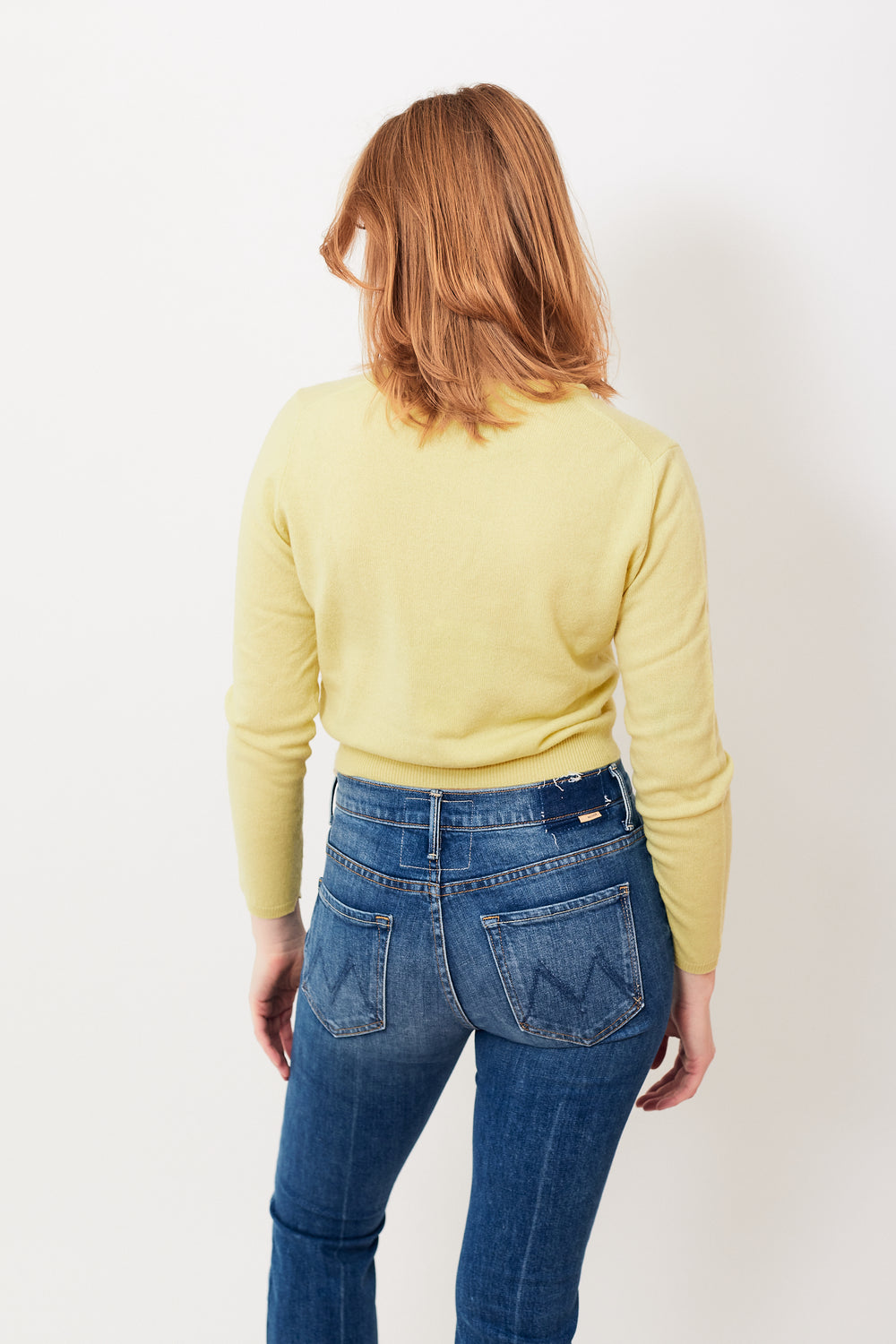 Waverly wearing Allude Cropped Cashmere V Sweater rear view