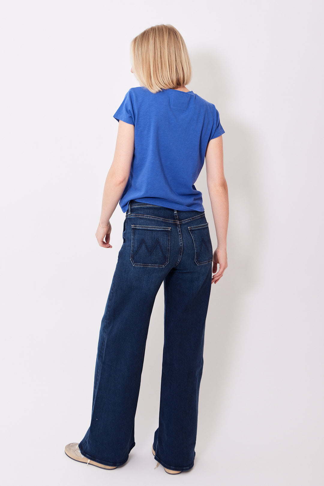 Madi wearing Mother Denim Drawn Undercover Prep Sneak rear view