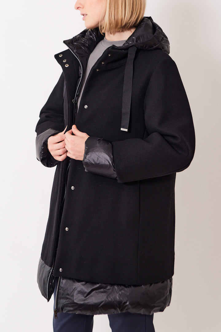 Madi wearing Herno Eco Wool A Shape Coat With Shiny Nylon Hood And Bottom black front view