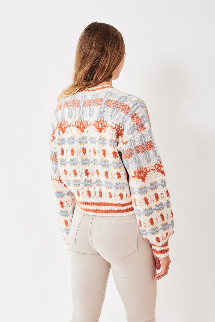 Mari wearing Mother Denim The Long Drop Pullover rear view