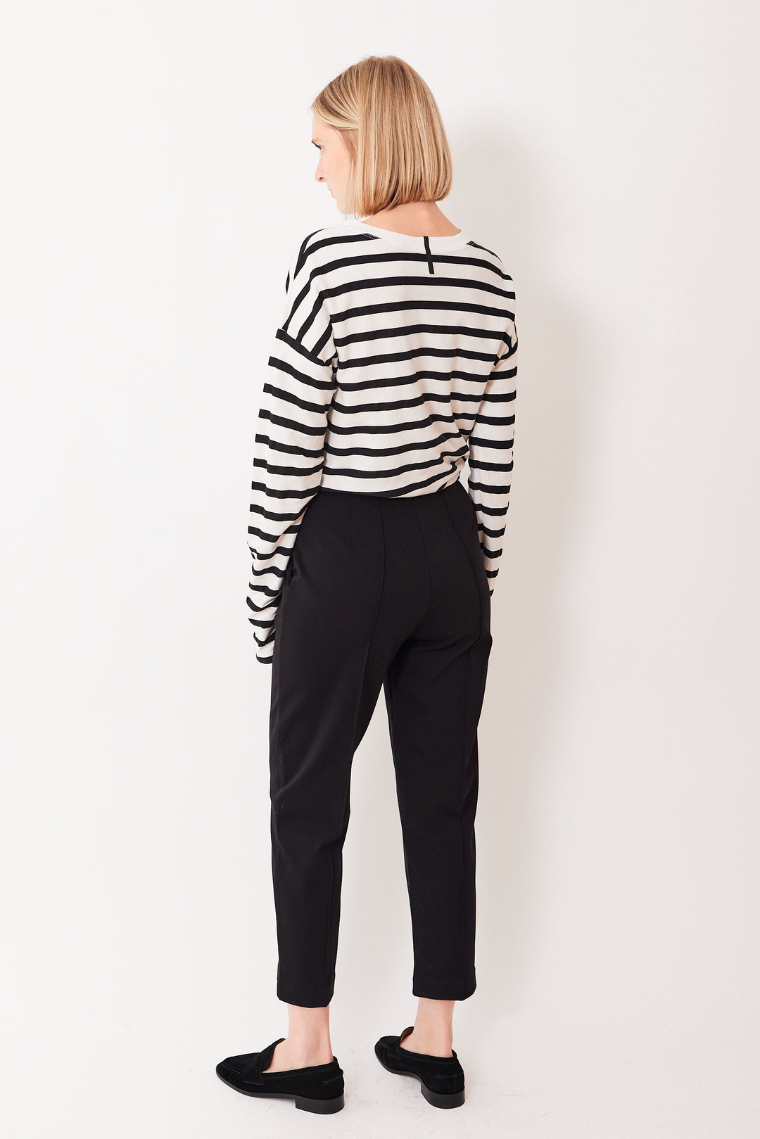 Madi wearing Meimeij Front And Back Seamed Stretch Trouser rear view