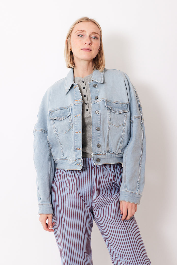 Madi wearing Ganni Tint Denim Bomber Jacket front view