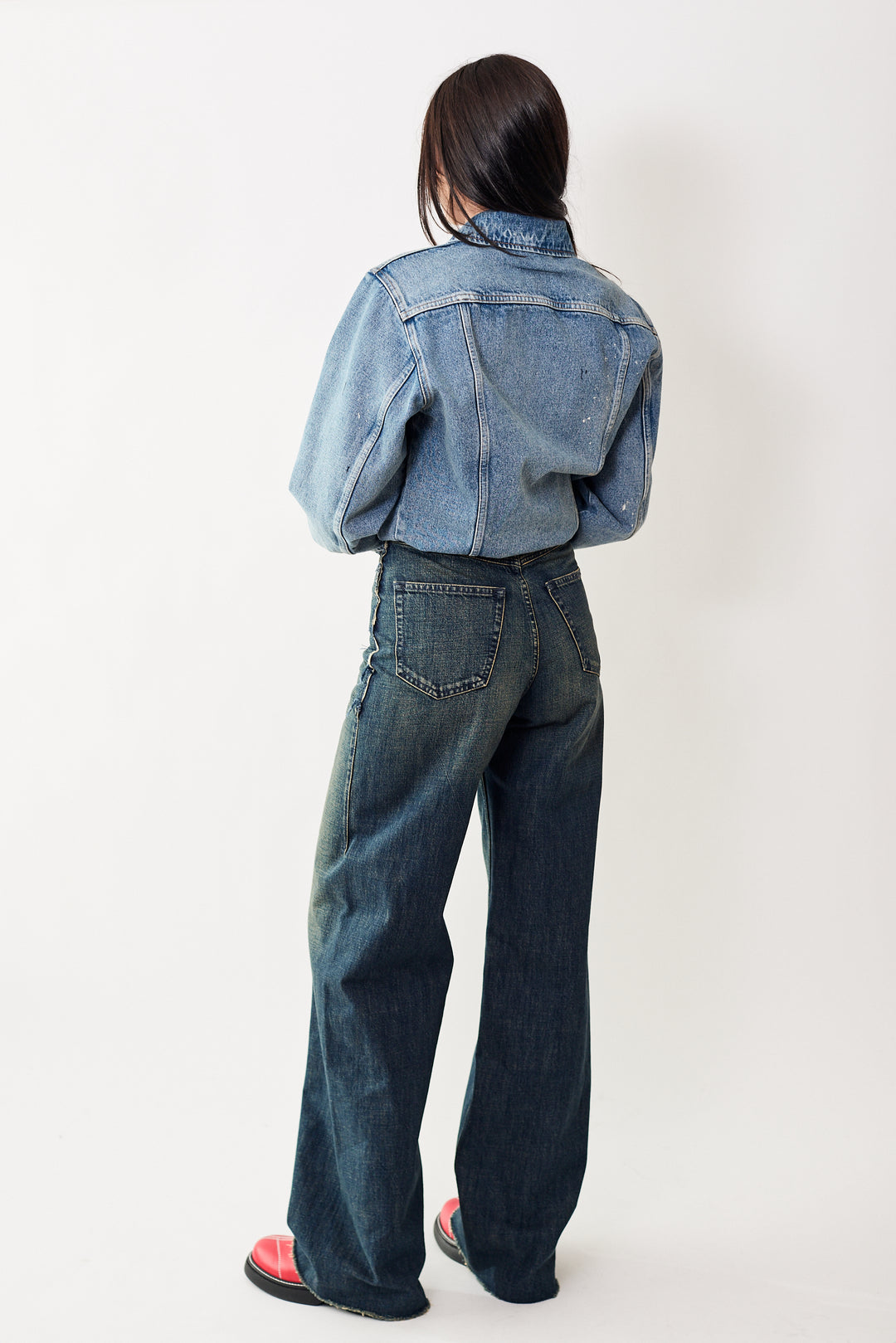 Julia is wearing MM6 by Maison Margiela Raw Seam Full Denim Trouser rear view