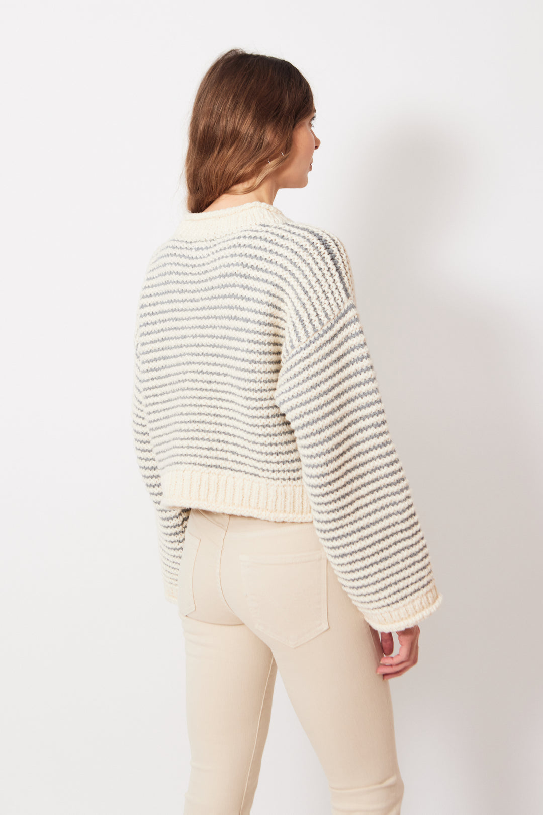 Mari wearing Mother Denim The Bell Sleeve Jumper Roll rear view