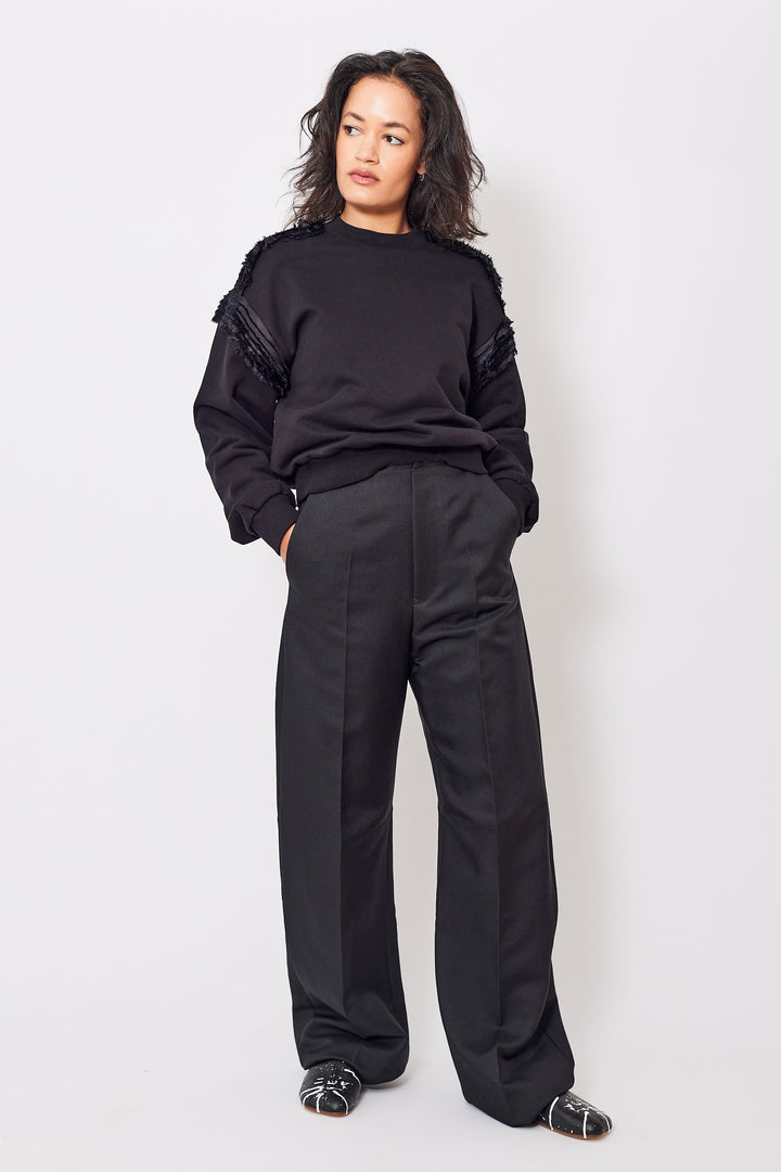 Amanda wearing MM6 Maison Margiela Creased Raw Edge Waist Poly Trouser front view