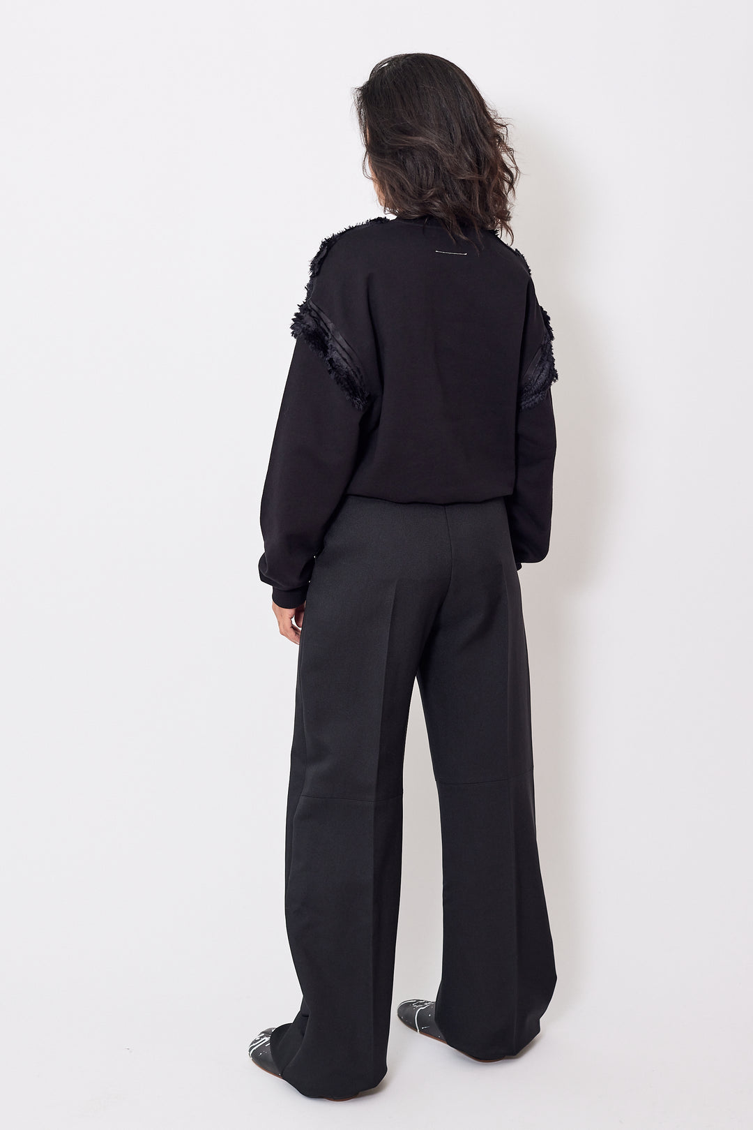 Amanda wearing MM6 Maison Margiela Creased Raw Edge Waist Poly Trouser rear view