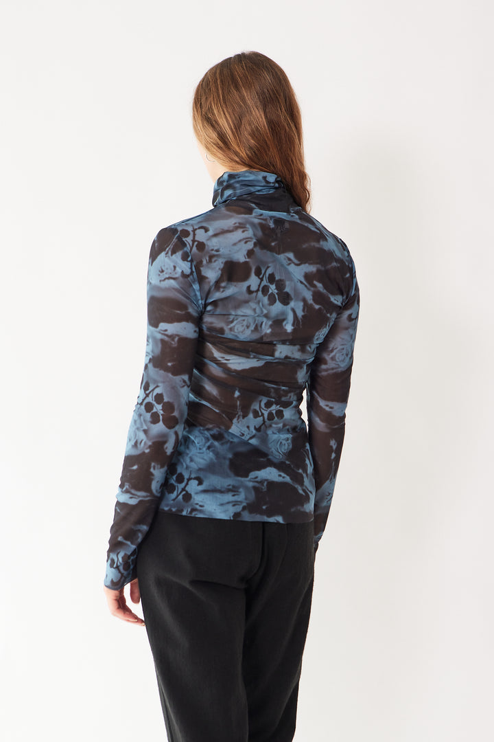 Mari wearing Ganni Printed Mesh Long Sleeve Rollneck rear view