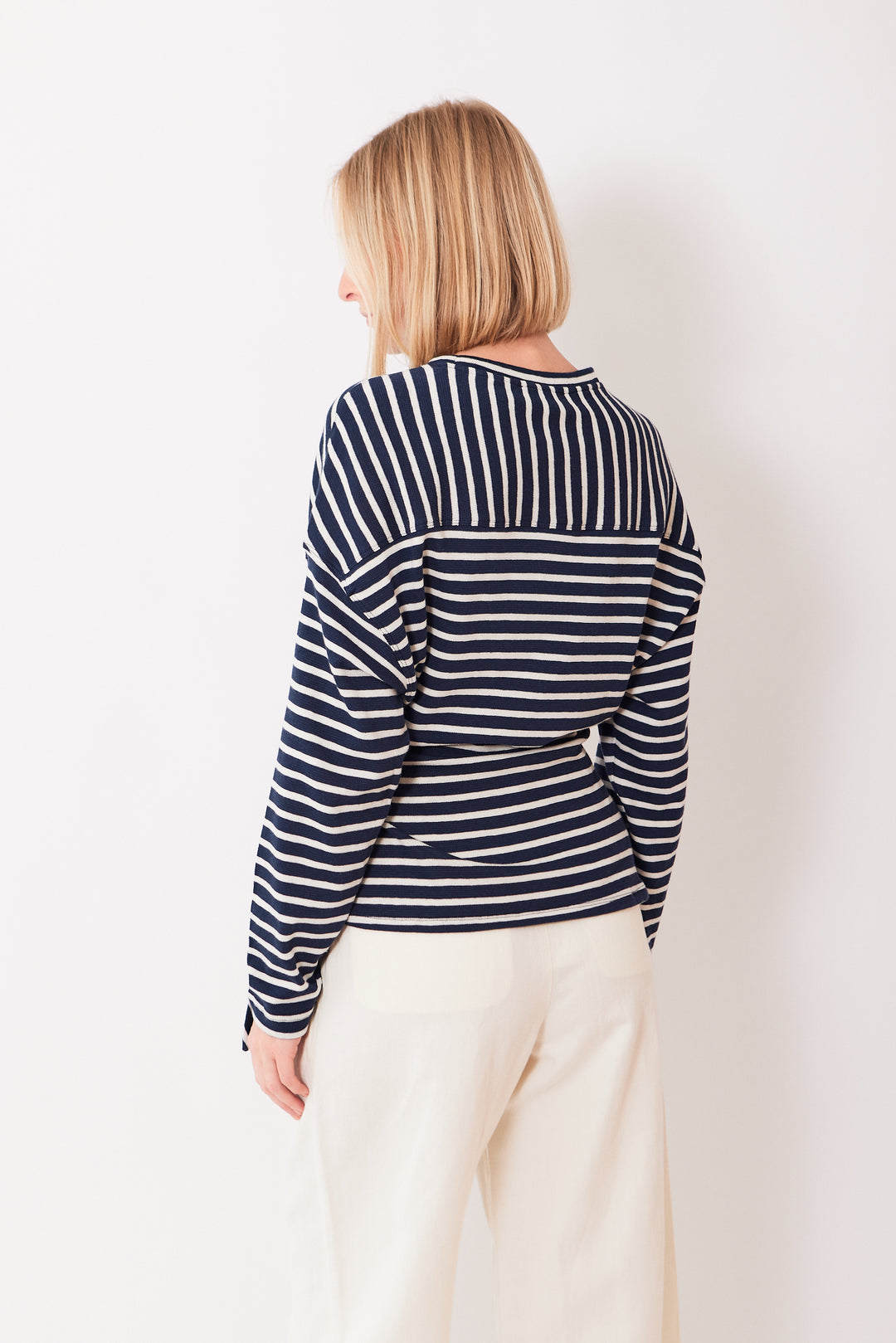 Madi wearing Apiece Apart Long Sleeve Vanina Top rear view